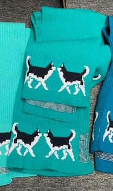 Knit Ponchos with Huskies on them.